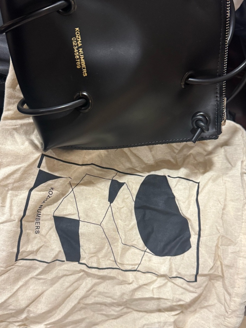 black 100% leather KOZHA NUMBERS utility purse with zipper closure - Picture 8 of 9